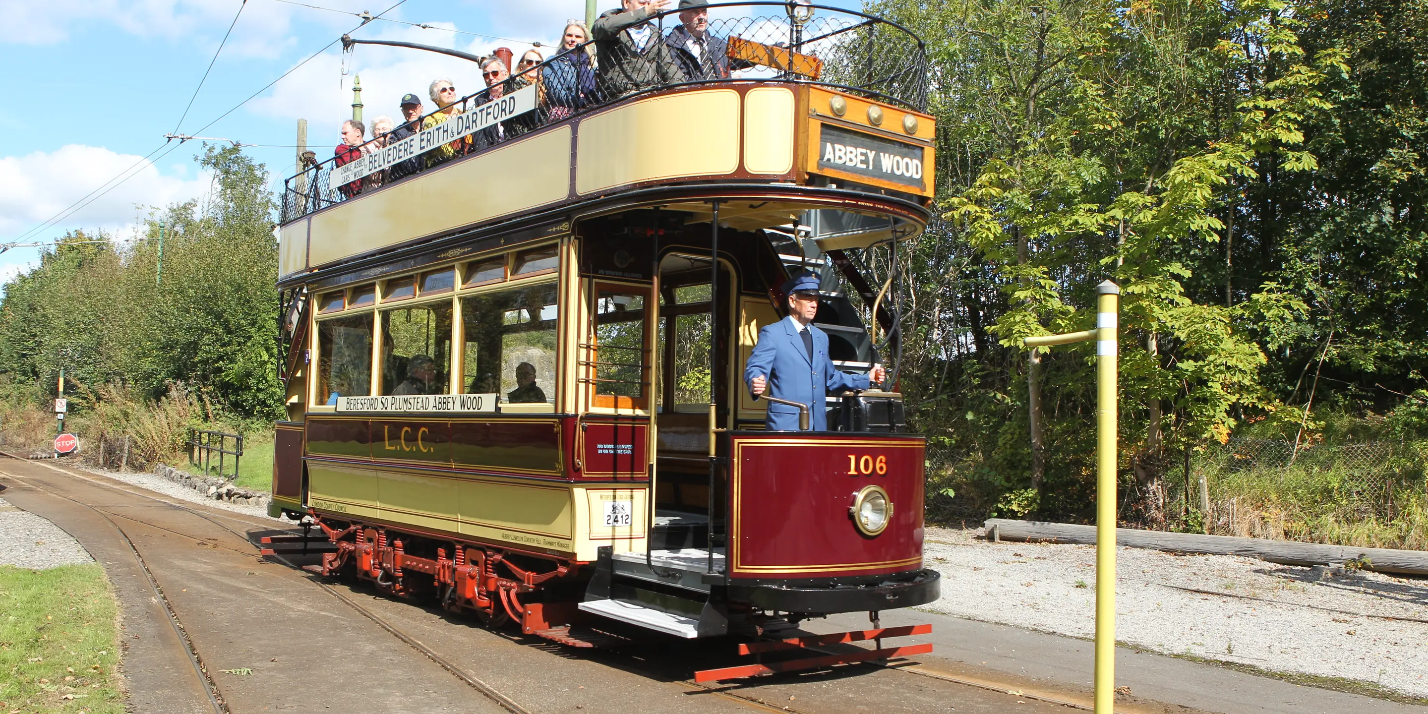 LCC 106 running through the museum street with passengers on the open top deck
