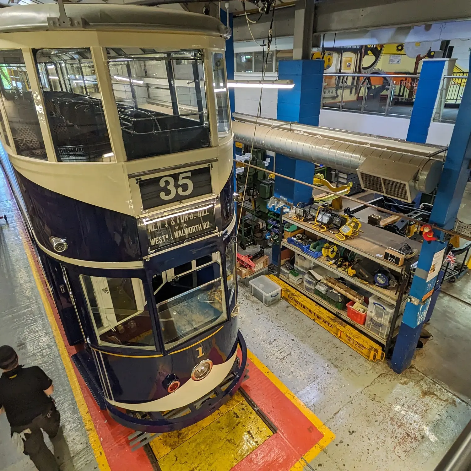 A tram under restoration in the museum workshop